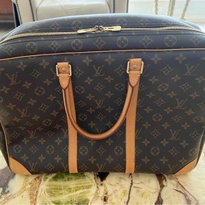 Authentic Vuitton soft sided overnight bag in like new condition.